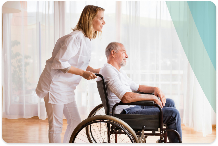 Woman pushing a man in a wheelchair